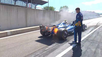 Carlos Sainz's car ablaze at the Austrian GP