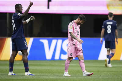 PSG's Pacho gestures as Messi walks off the field during Club World Cup match.